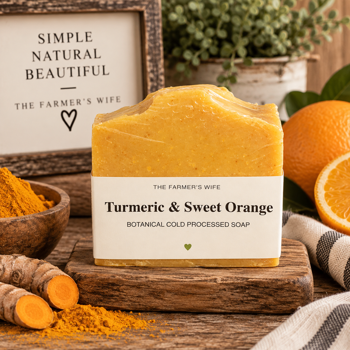 Turmeric & Sweet Orange Soap by The Farmer's Wife in warm golden orange with current vellum heart label
